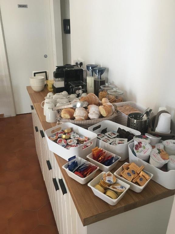 Breakfast buffet with pastries, yoghurt and coffee
